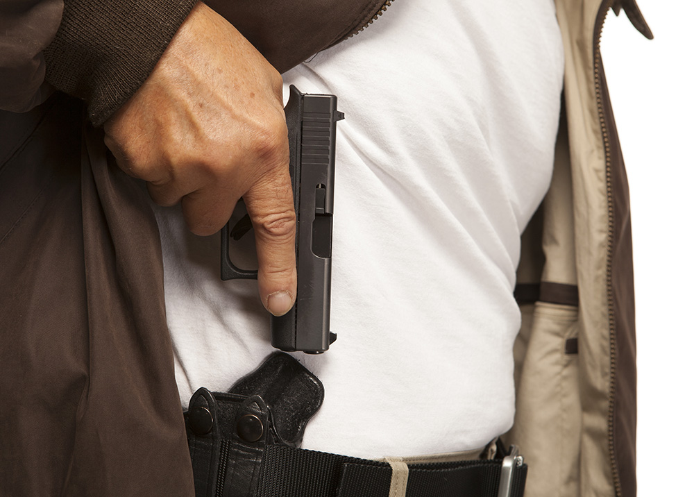 Man concealed carrying with a IWB holster