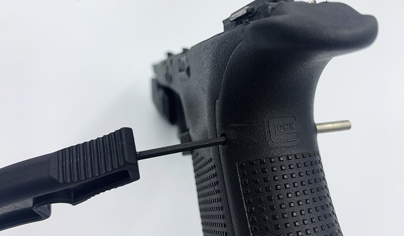 removing glock trigger housing pin