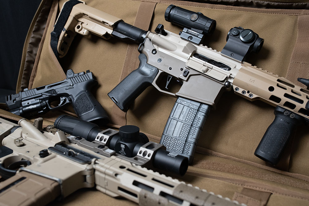 Medley of guns with a moonshine AR15 pistol Medley of guns with a moonshine AR15 pistol