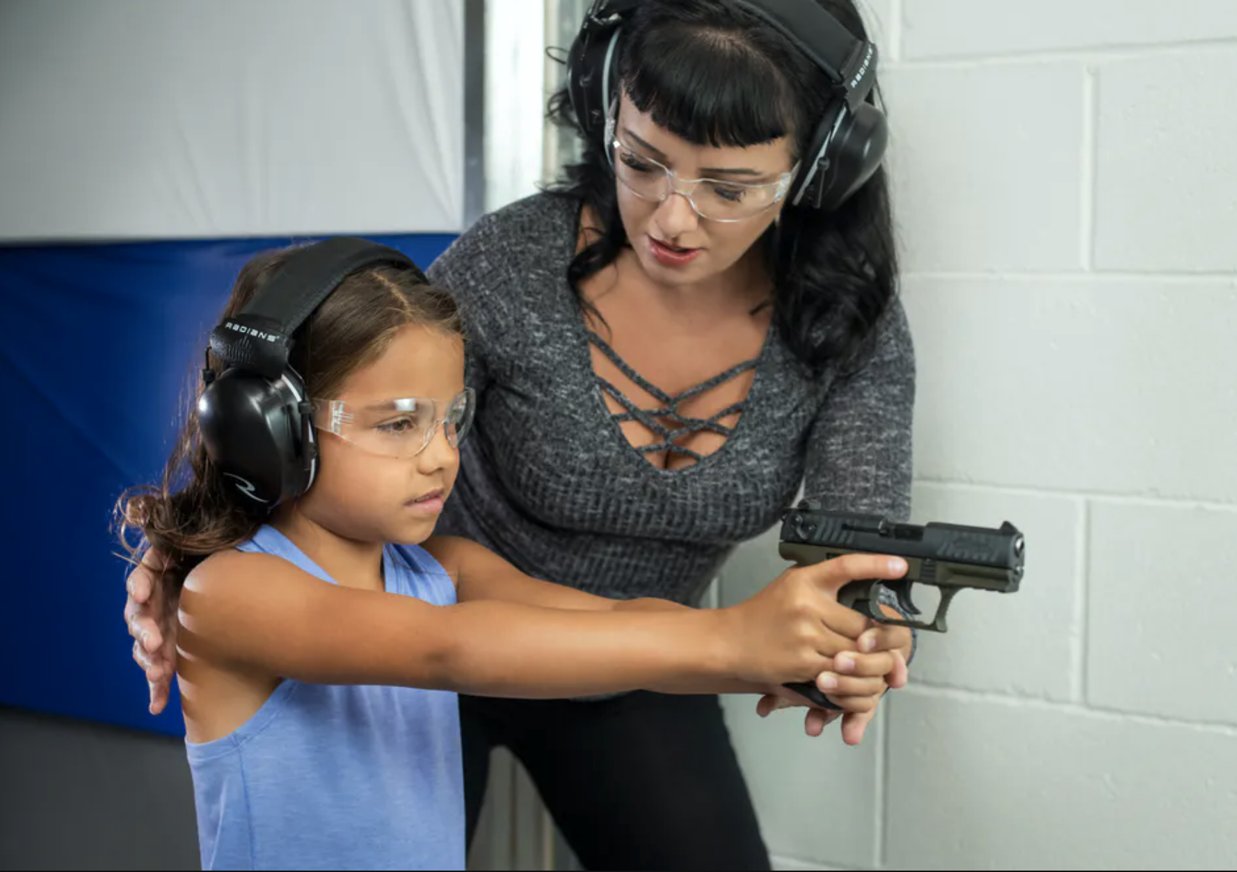 small size child with walther pistol and gun range small size child with walther pistol and gun range